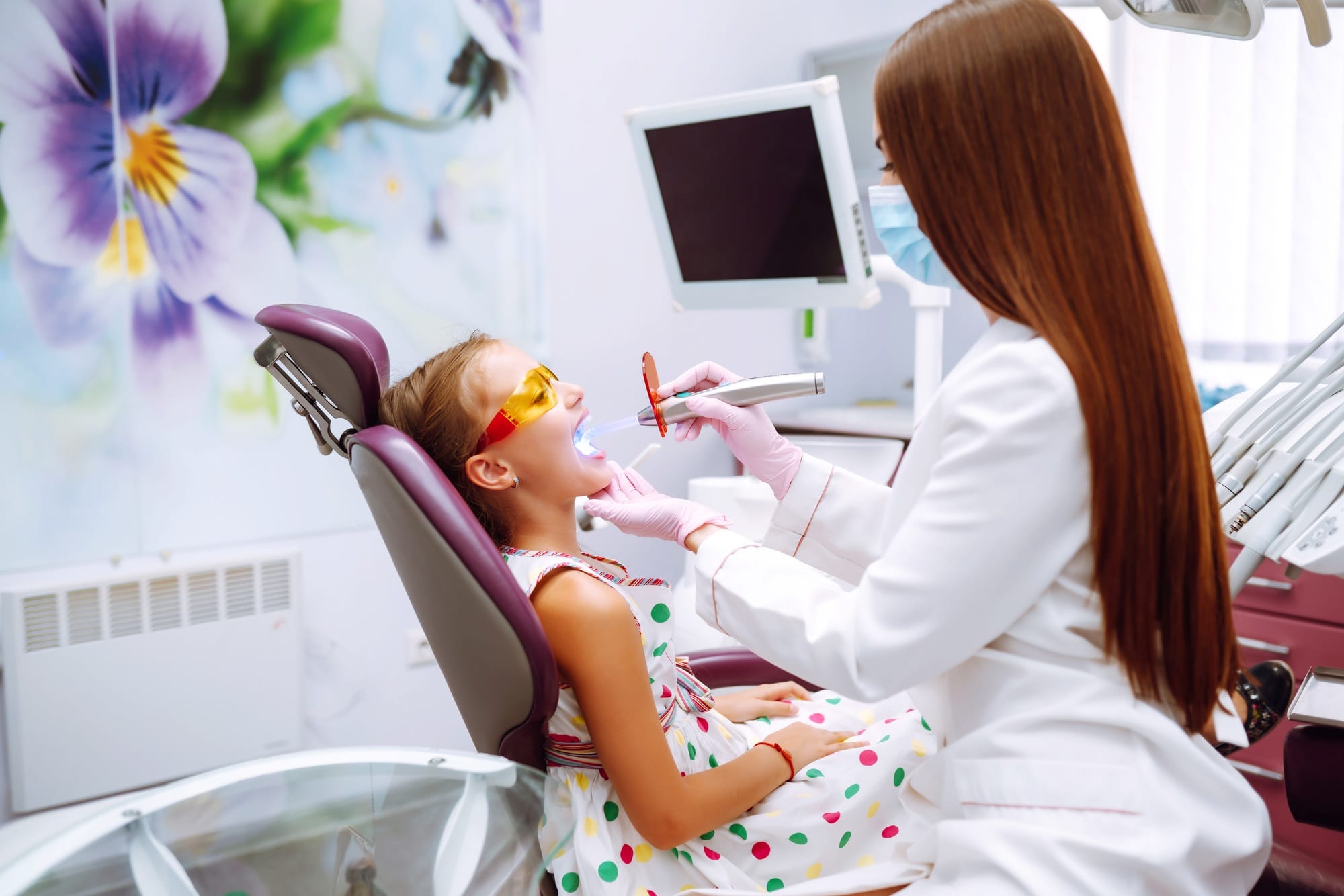 Lovely little girl smiling after doing examination in a pediatric stomatology. Milk teeth care. Lovely little girl smiling after doing examination in a pediatric stomatology. Milk teeth care.