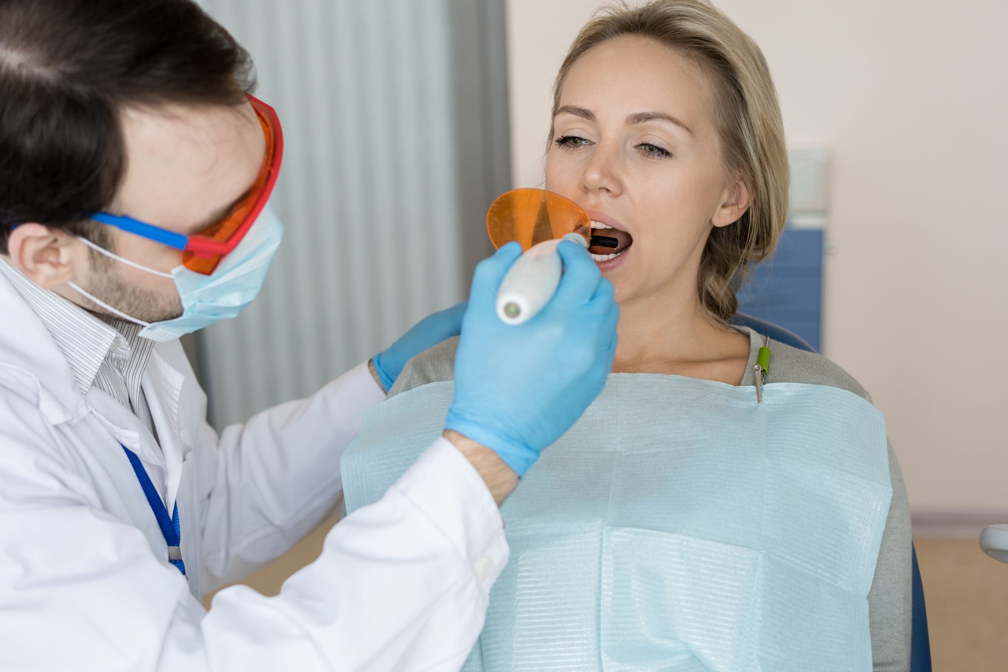 Man making tooth filling Man making tooth filling