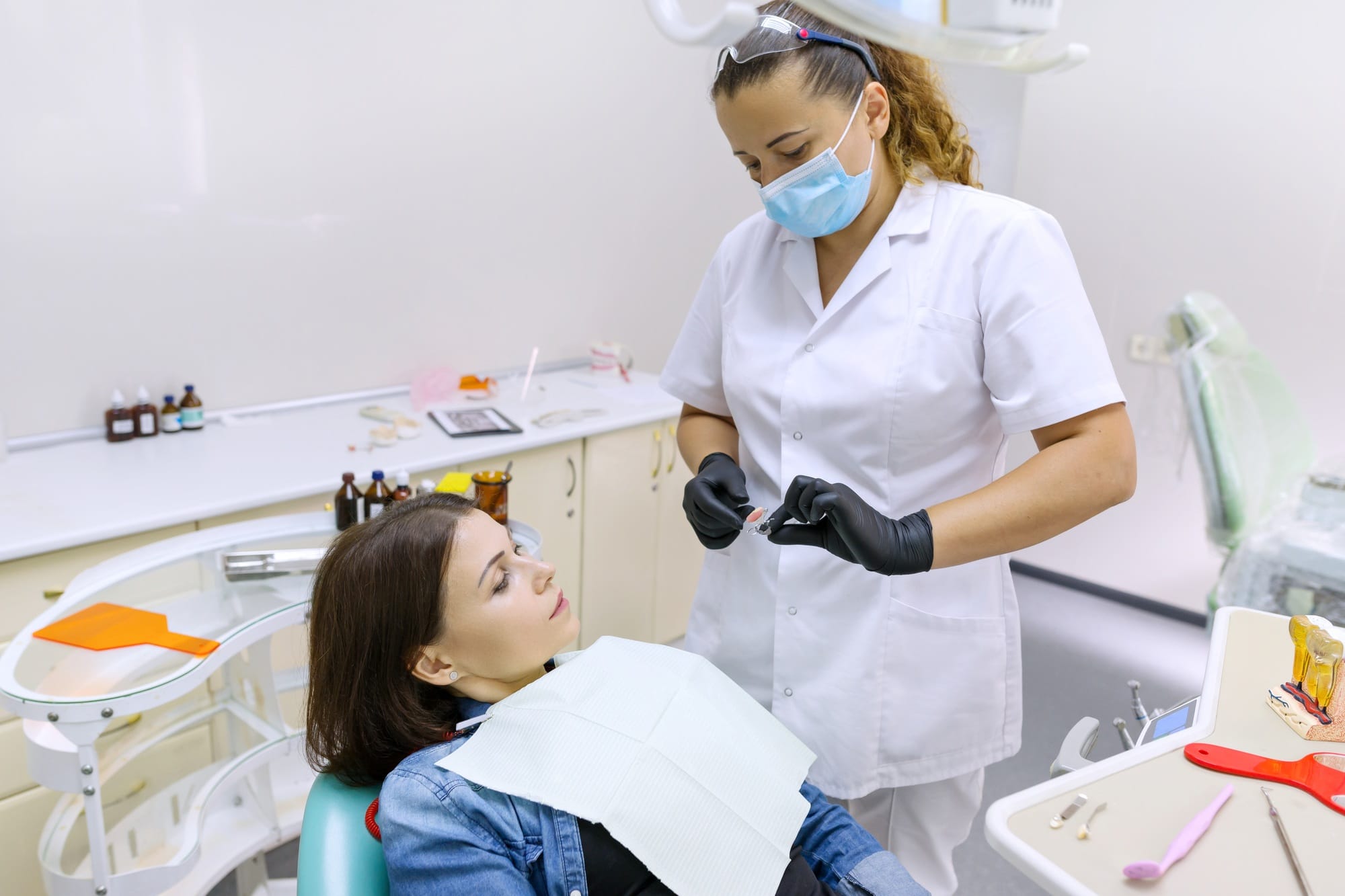 Partial denture, mature woman patient sitting in dental chair Partial denture, mature woman patient sitting in dental chair