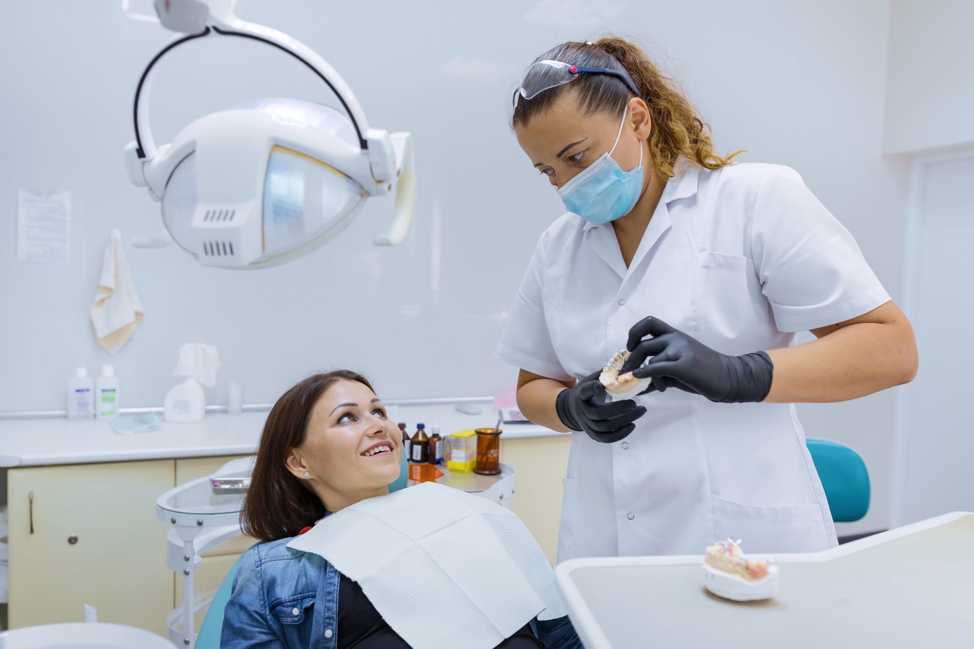 Prosthetics and dental treatment, model of the jaw in the hands of a dentist Prosthetics and dental treatment, model of the jaw in the hands of a dentist