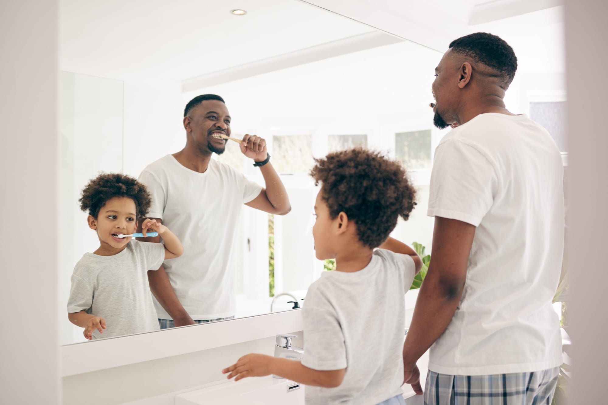 Brushing teeth, black family and cleaning morning routine in a bathroom with a dad and child. Hygie Brushing teeth, black family and cleaning morning routine in a bathroom with a dad and child. Hygie