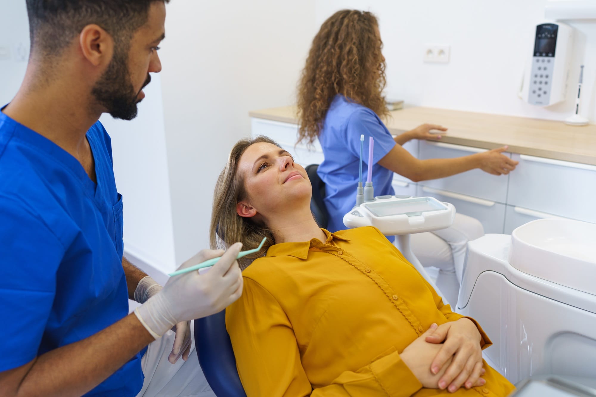 Dental examination of young woman at dental clinic. Dental examination of young woman at dental clinic.