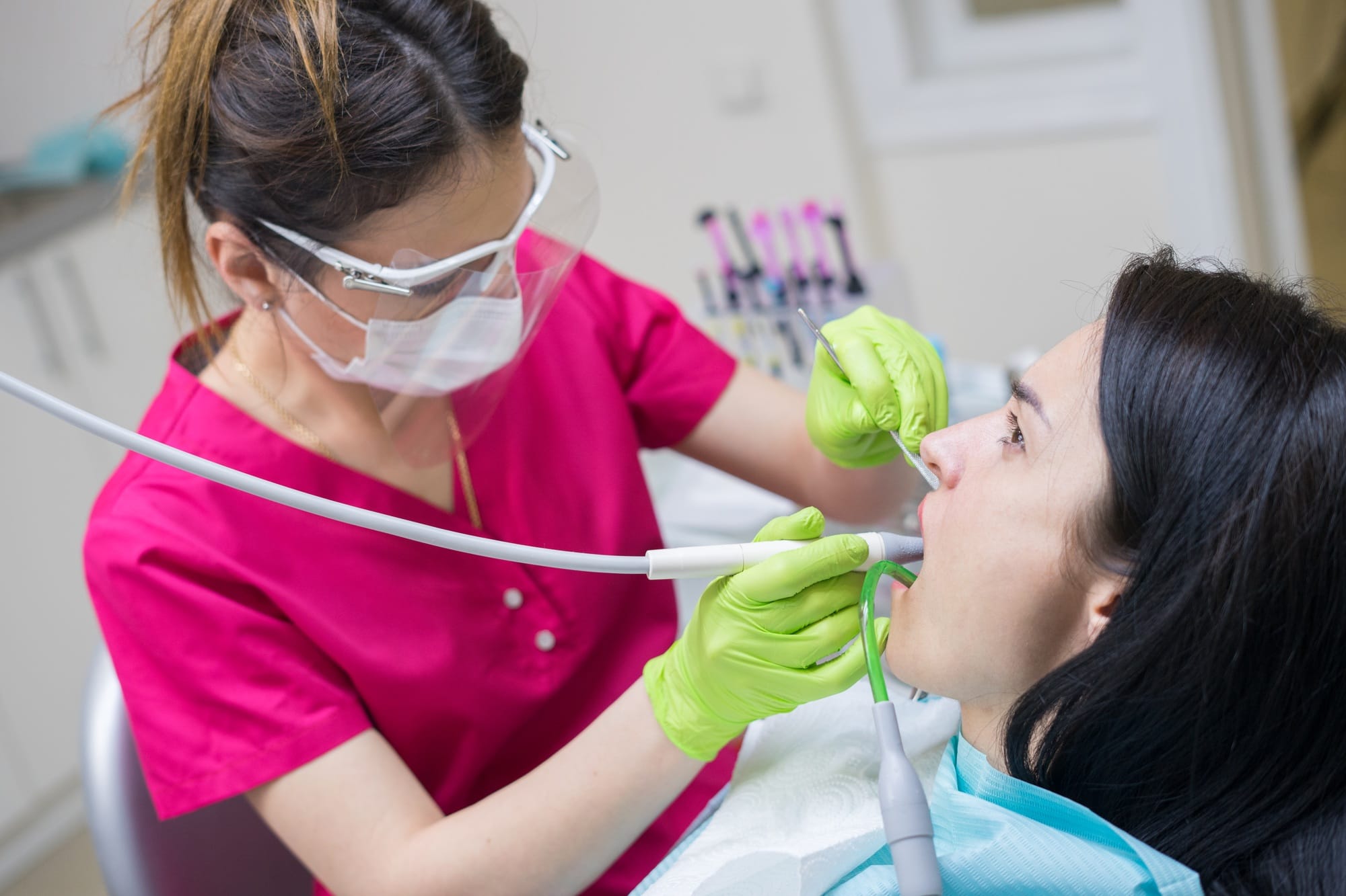 dentist cleaning teeth of woman dentist cleaning teeth of woman