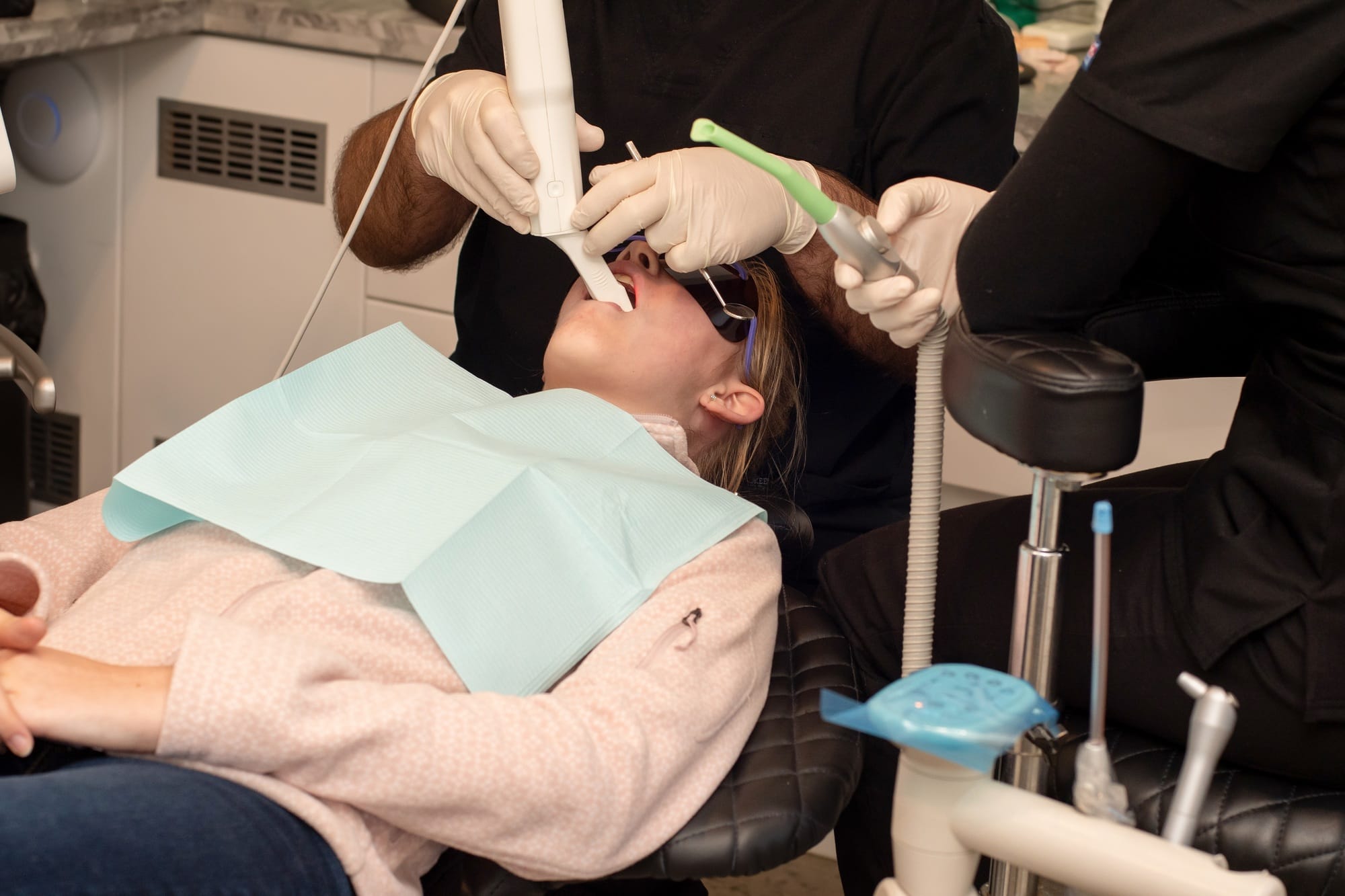 Orthodontist using digital scanner to make 3D image of the teeth and gums . Orthodontic treatment Orthodontist using digital scanner to make 3D image of the teeth and gums . Orthodontic treatment