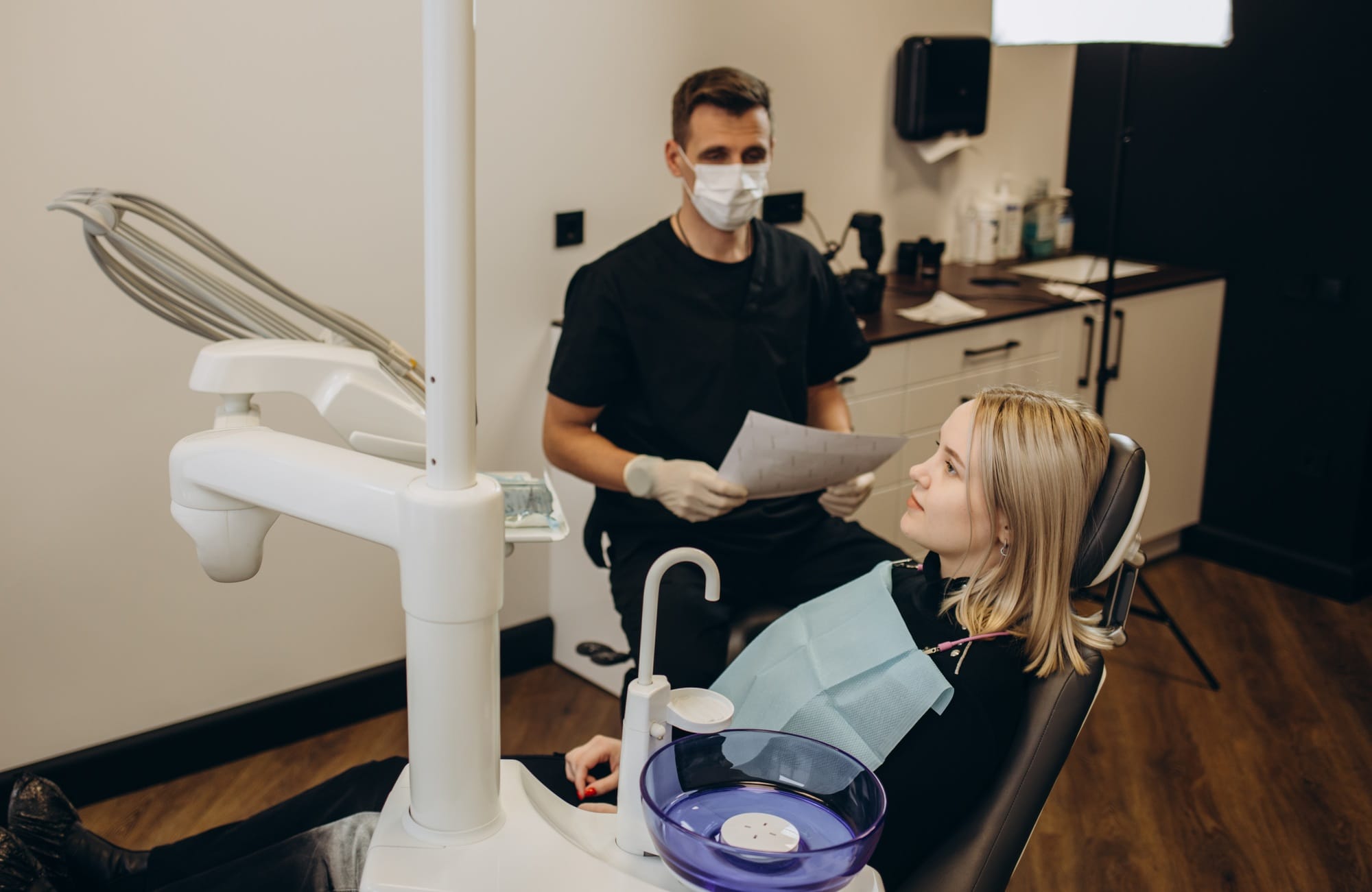 Teenage girl with dental braces visiting orthodontist at dentist's office. Teenage girl with dental braces visiting orthodontist at dentist's office.