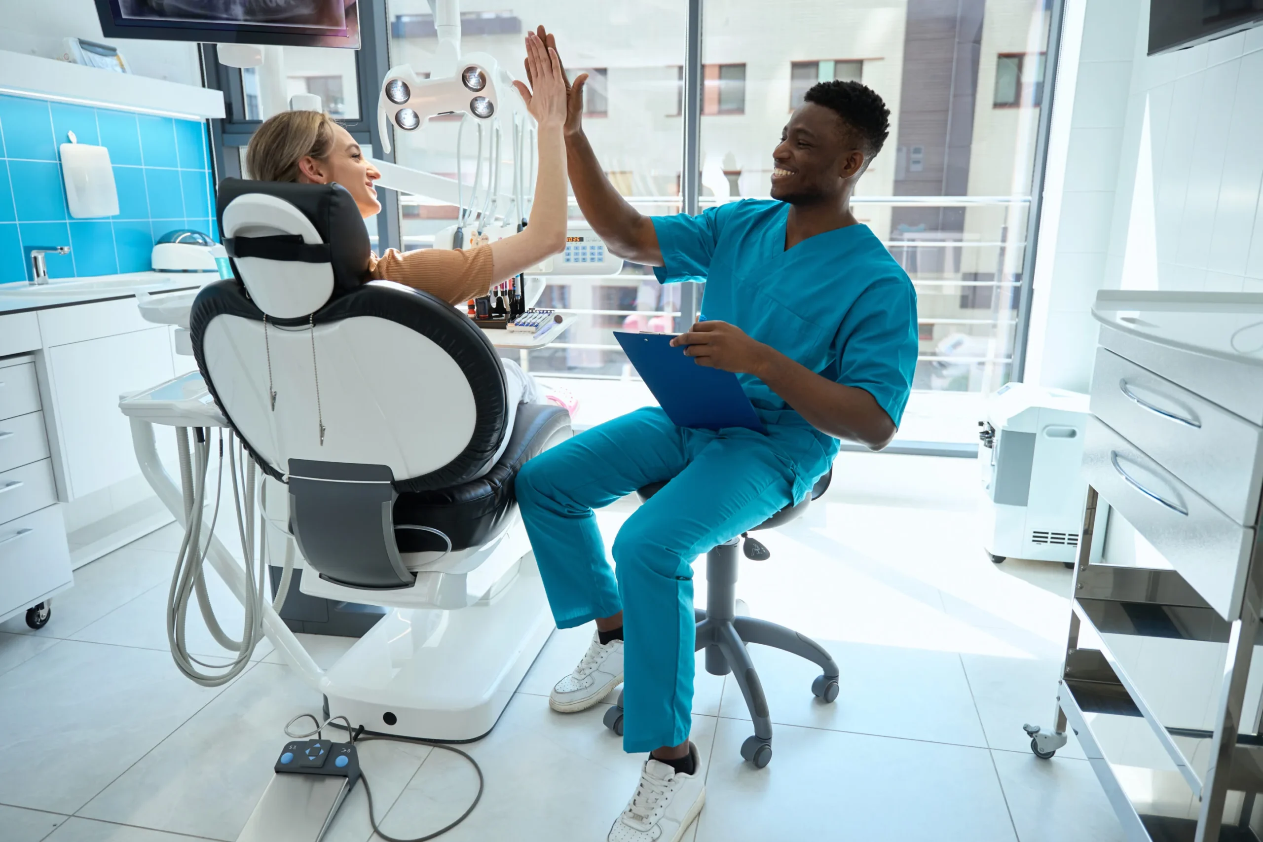 happy-man-listening-woman-working-in-hospital-2024-10-20-10-32-07-utc-scaled Patient paying for dental visit in clinic